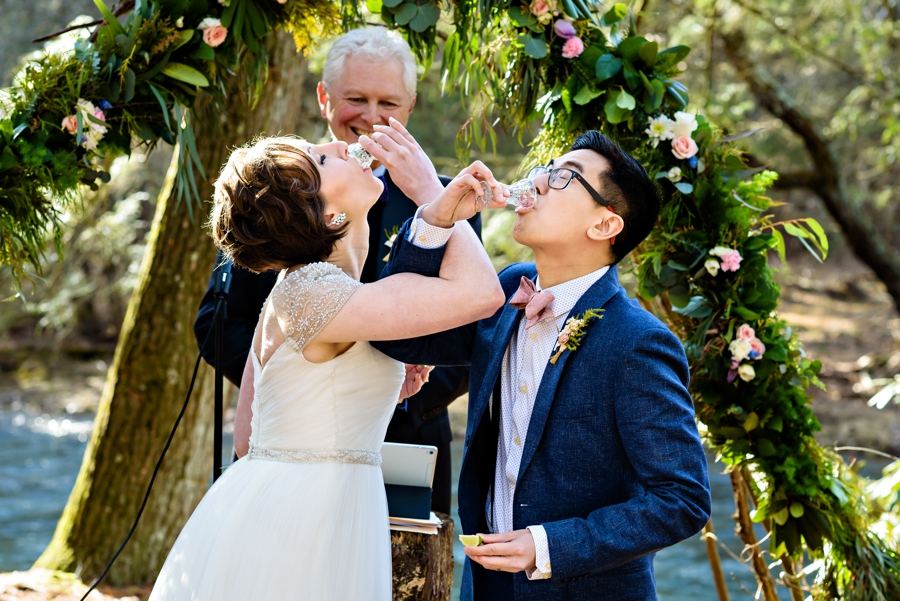 A bride and groom do shots of Tequila during thier rustic wedding at the Pump House B&B in Bloomsburg, PA.